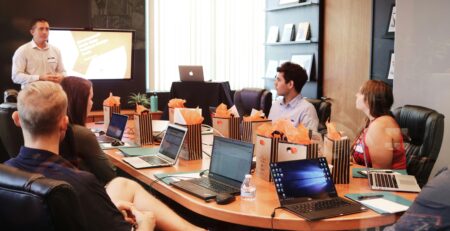 Conference room board meeting with one man presenting