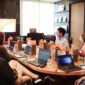 Conference room board meeting with one man presenting